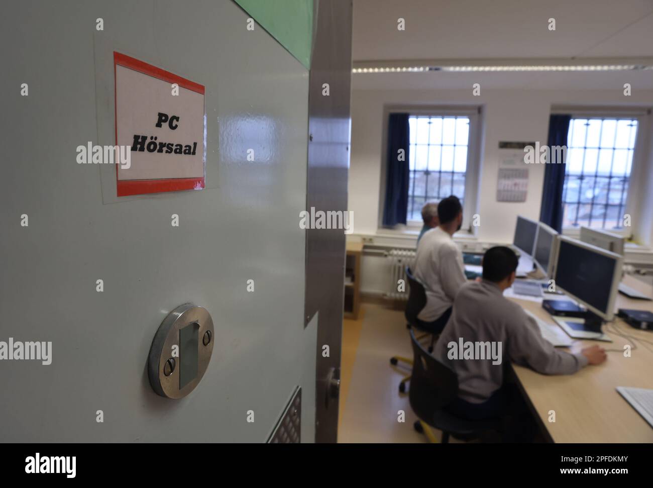 09 March 2023, Bavaria, Würzburg Student prisoners sit at computers in