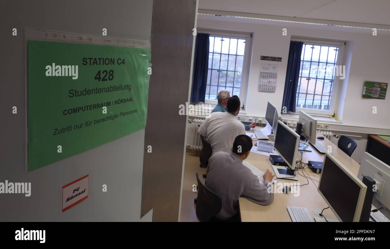 09 March 2023, Bavaria, Würzburg Student prisoners sit at computers in