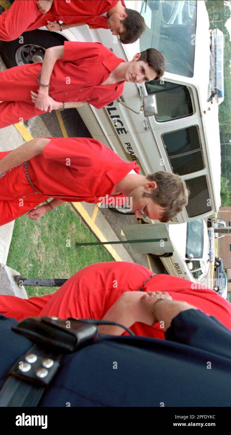 Pearl High School student Justin Sledge, center, and Grant Boyette 