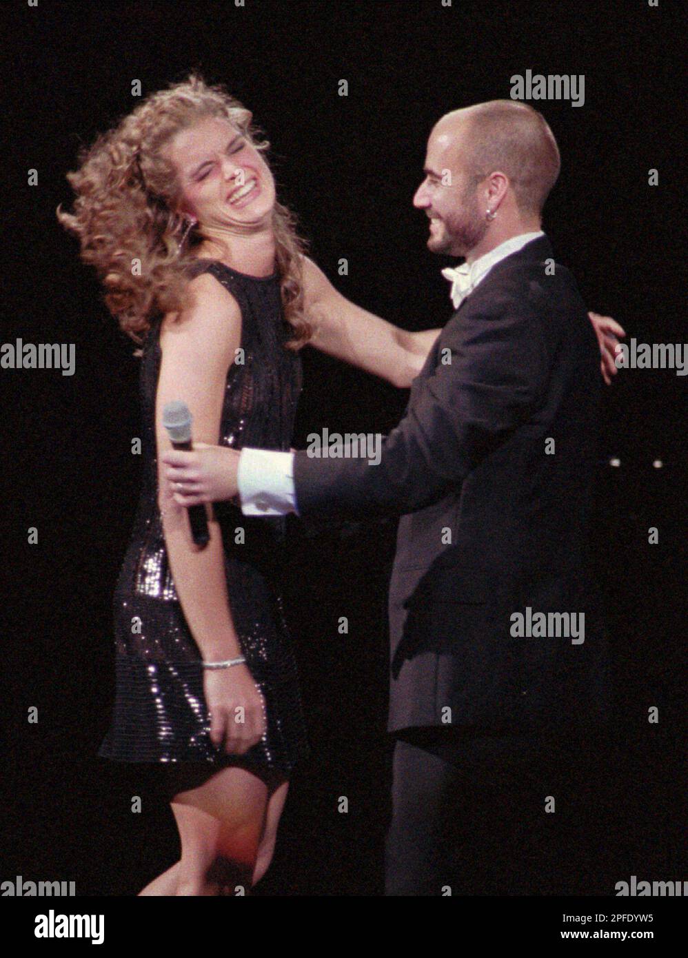 Actress Brooke Shields, left, reacts after her husband Andre Agassi ...