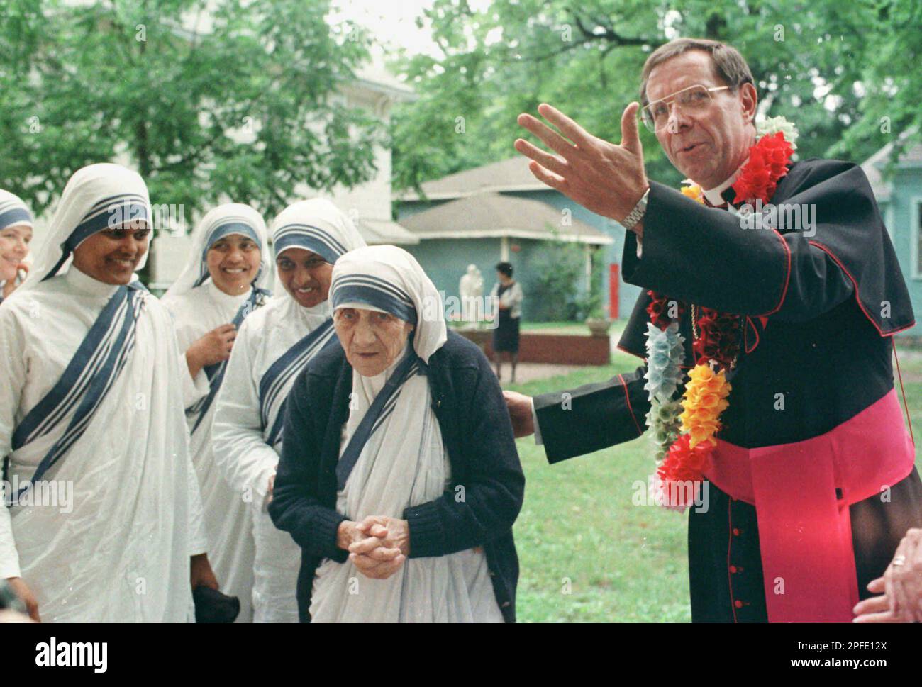 Bishop Daniel Buechlein escorts Mother Teresa into his home in Memphis,  Tenn., June 4, 1989. Mother Teresa is visiting Memphis to tour sites where  a house for unwed mothers could be built.