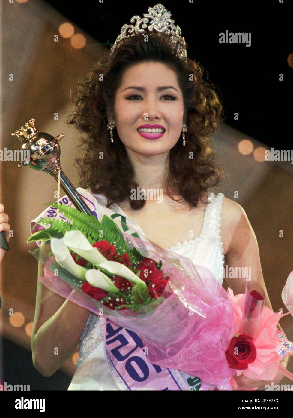Kim Giyeon, a 19yearold student of Seoul Art College, smiles with a trophy after being