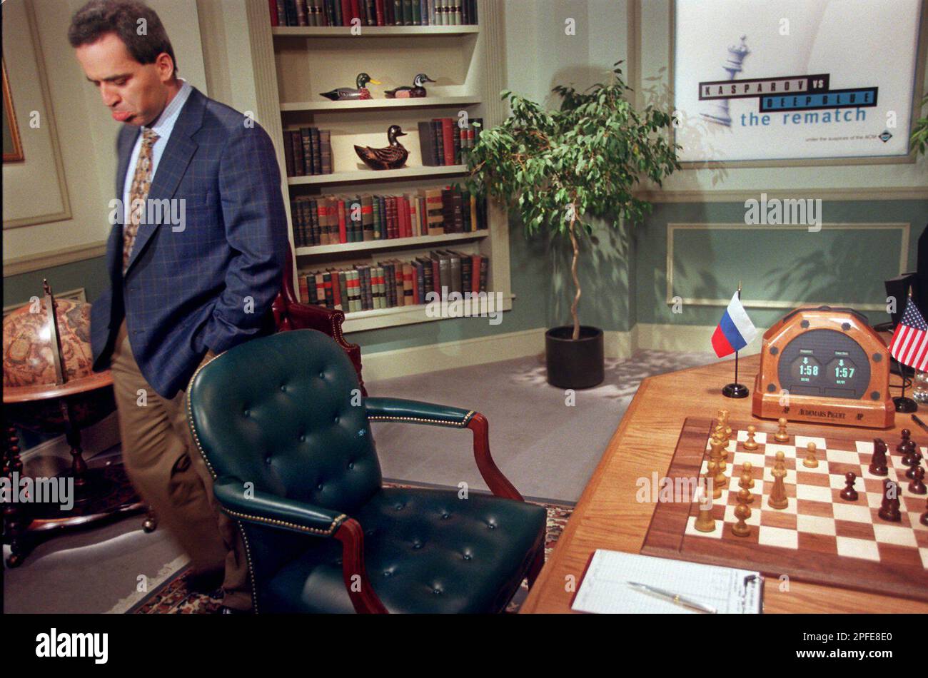 World chess champion Garry Kasparov walks around the playing room as he  waits for IBM's Deep Blue chess playing computer to make its next move  during the third game of their six