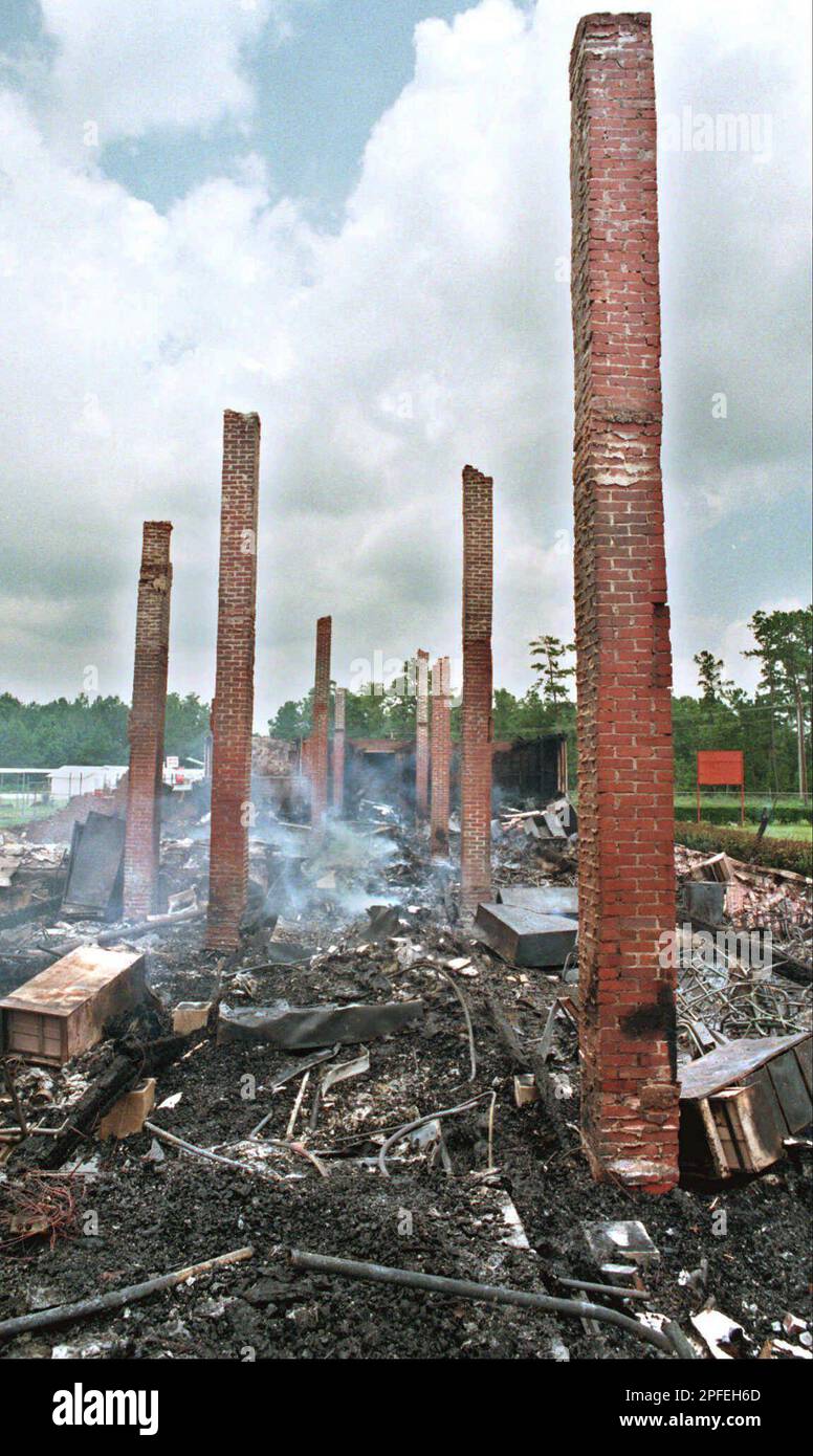 Chimney stacks stand tall in the charred remains of Macedonia High