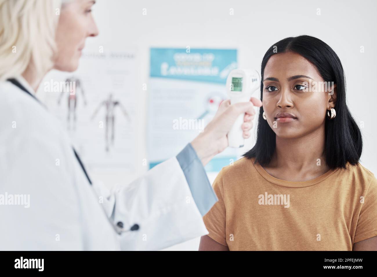 If you have a fever, its probably an infection. a doctor examining a woman with a thermometer