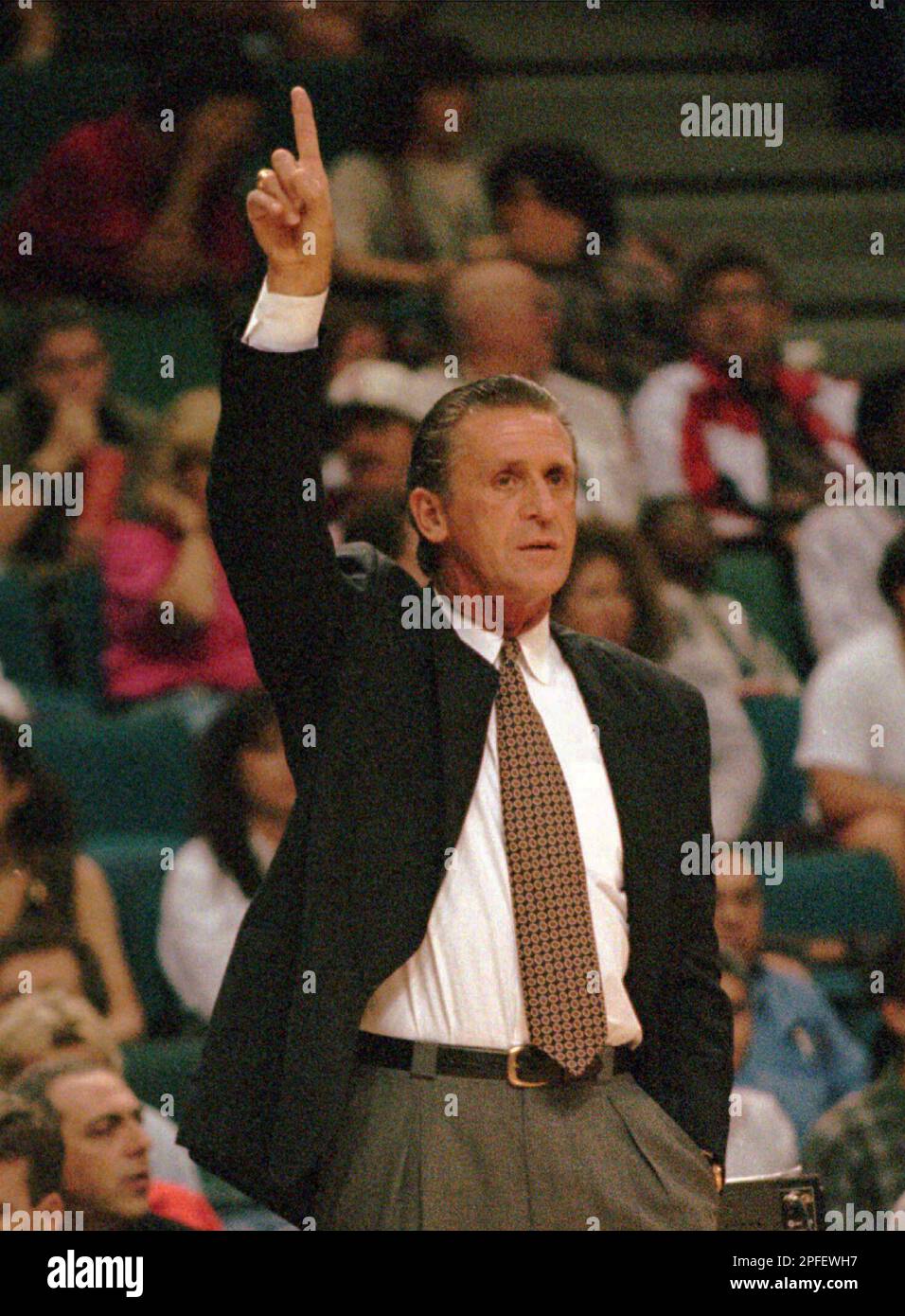 Miami Heat head coach Pat Riley signals during a preseason game against ...