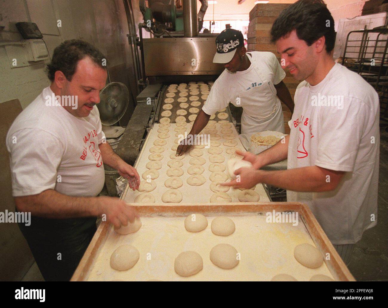 Marvin Wofsy, left, and Andrew Calo, right, employees of Bell's Bialys