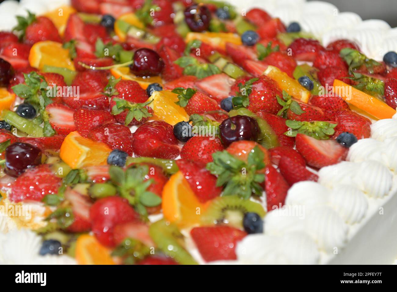 Close up of a white fruit cake at a wedding. Stock Photo