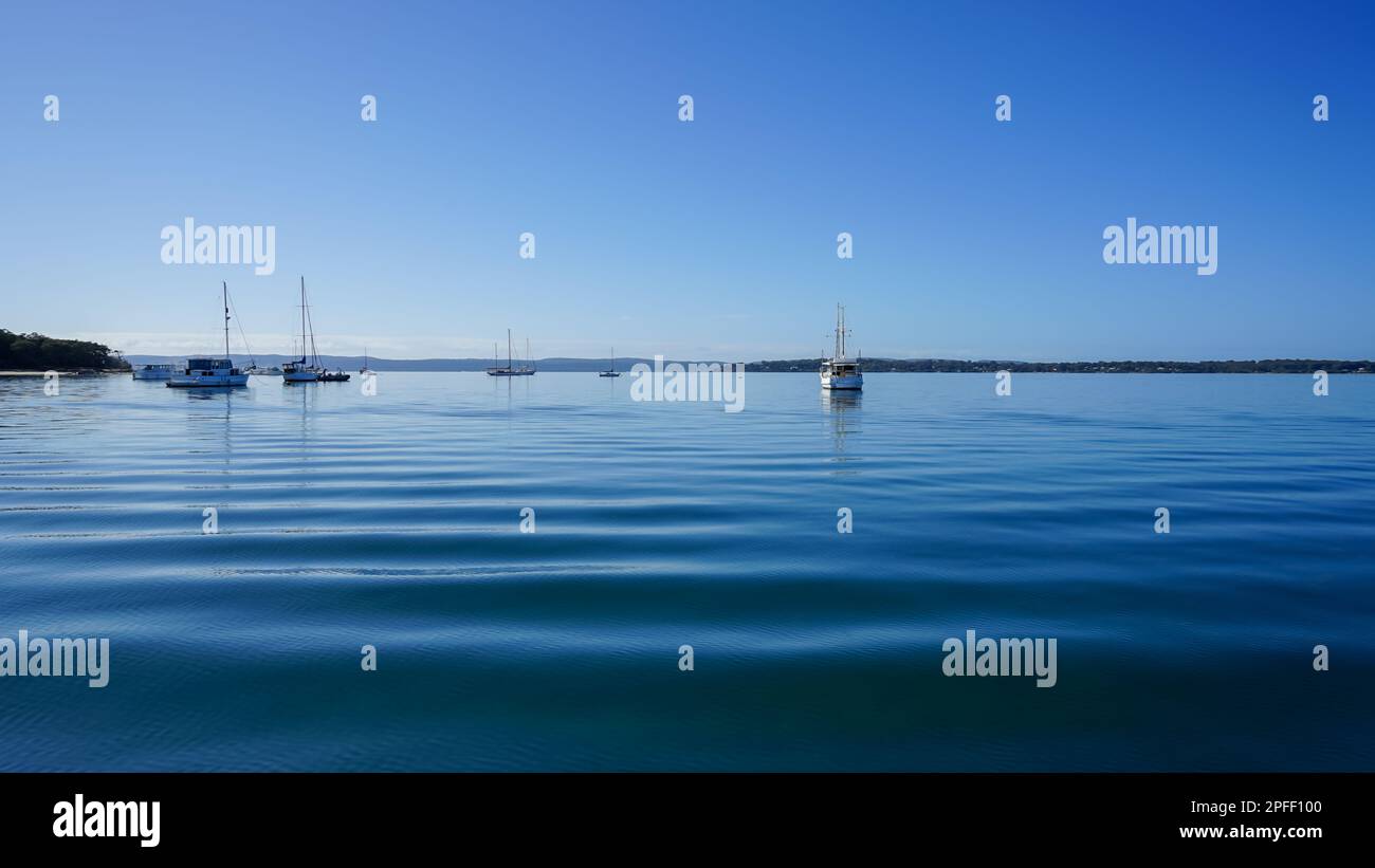 View across calm waters, offshore from Coochiemudlo Island past boats