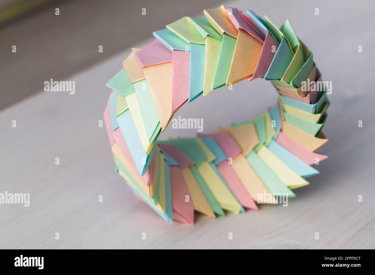 Origami ring, abstract parametric structure made of colorful paper ...