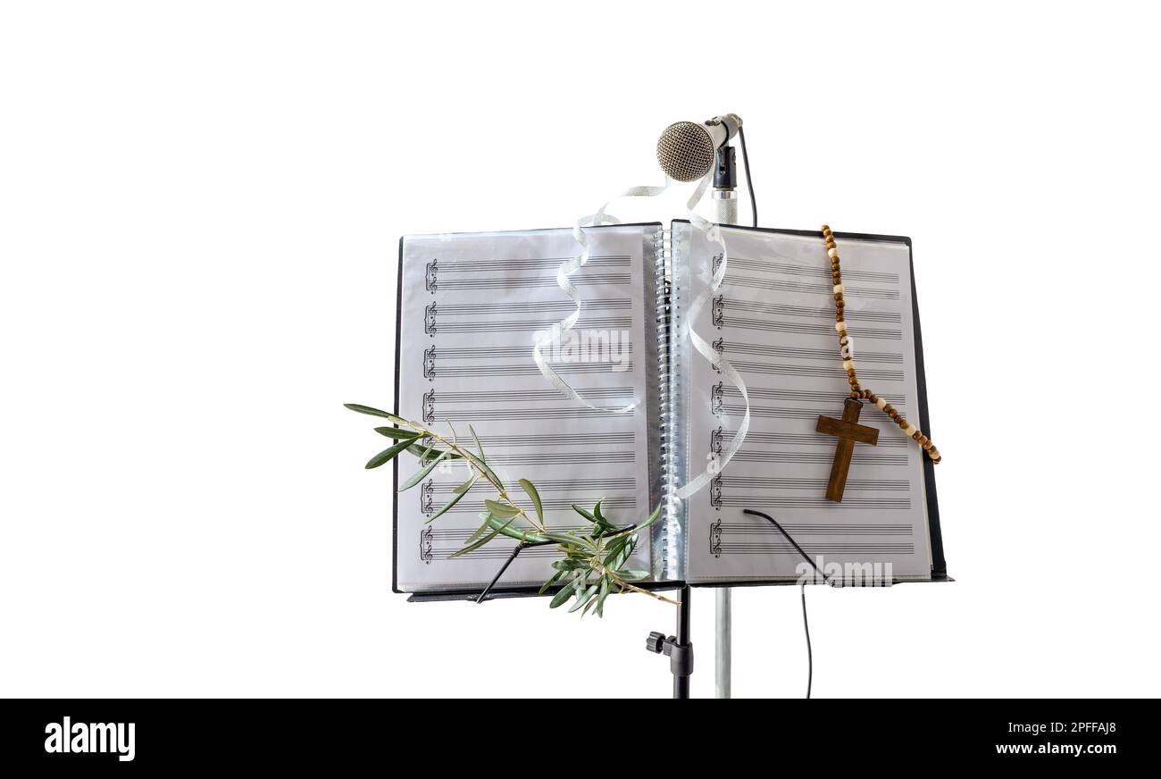 Microphone and music stand with folder with sheet music behind isolated on white background. Front view. Stock Photo