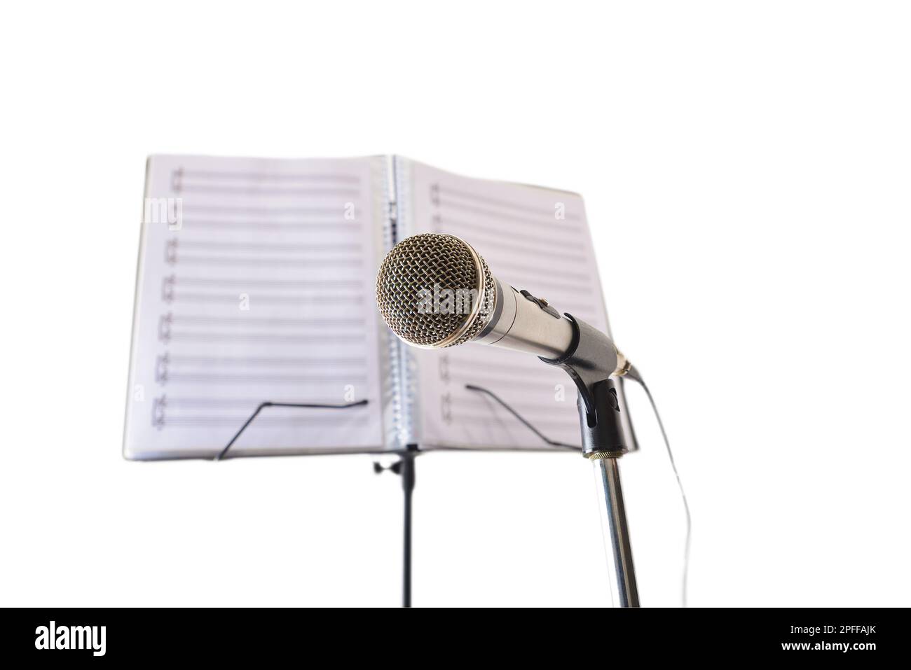 Microphone and music stand with folder with sheet music behind isolated on white background. Front view. Stock Photo