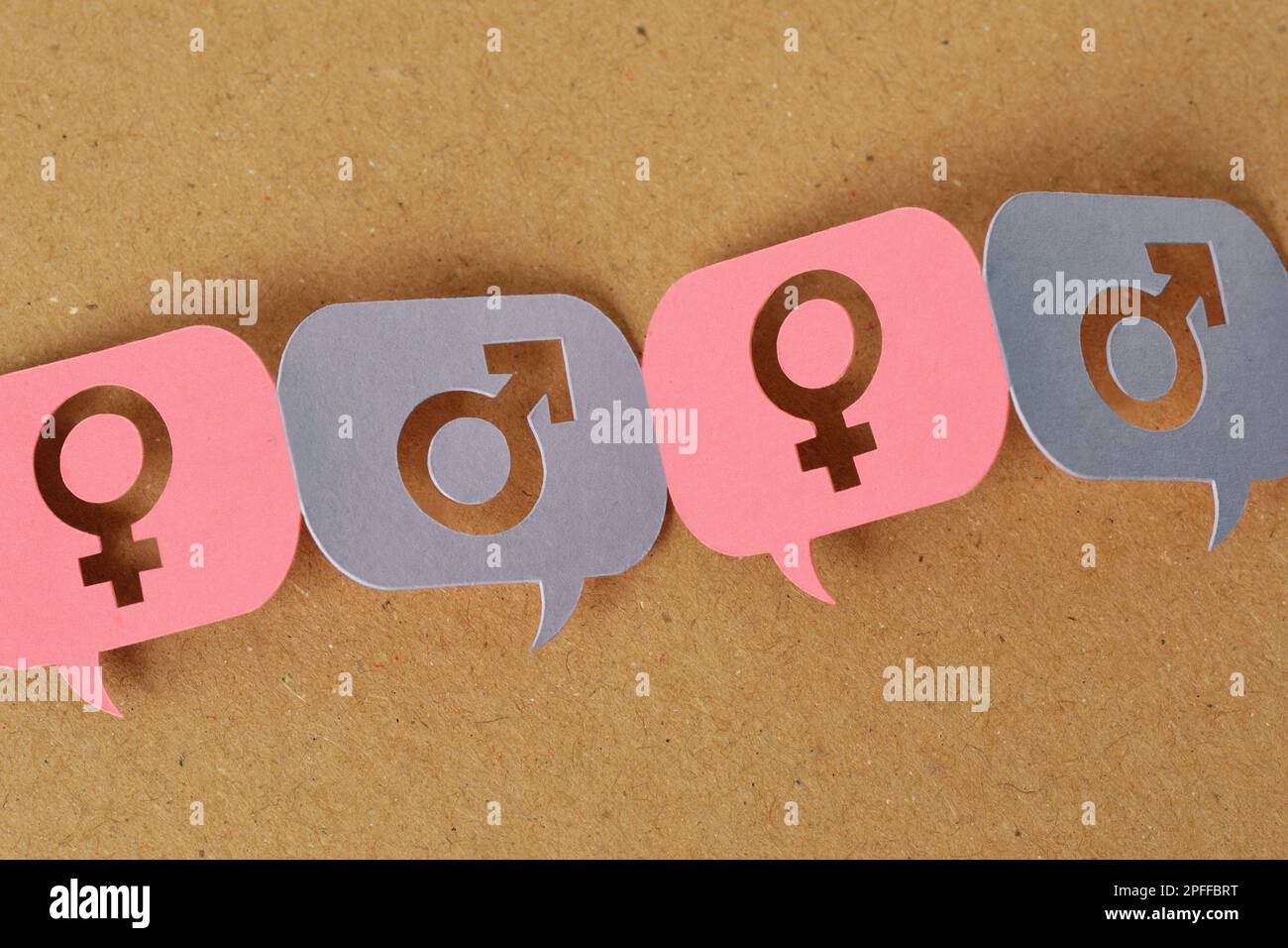 Pink and blue speech bubbles with female and male gender symbol linked