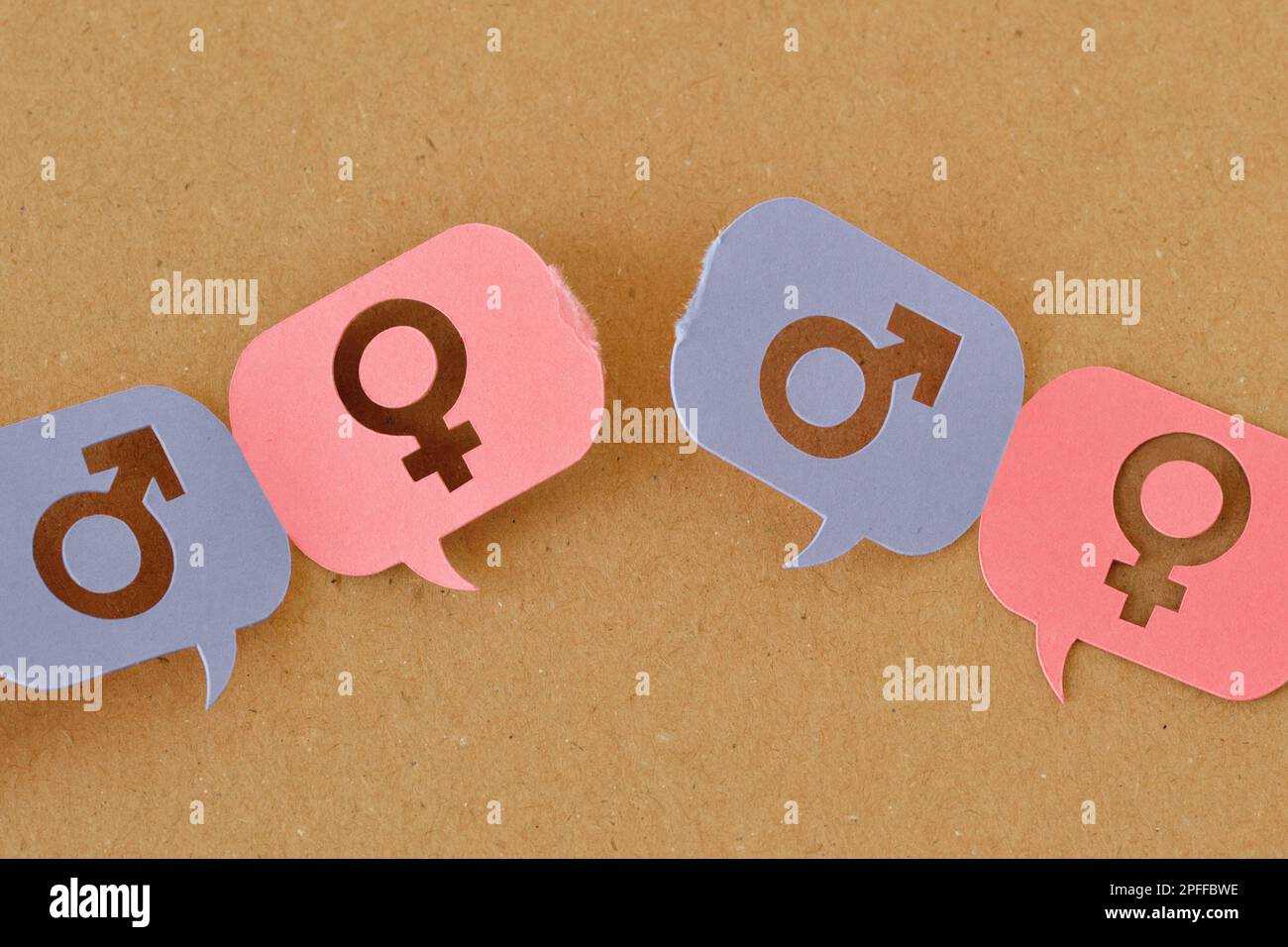Broken chain of pink and blue speech bubbles with female and male gender symbol - Concept of communication differences between men and women (gender c Stock Photo