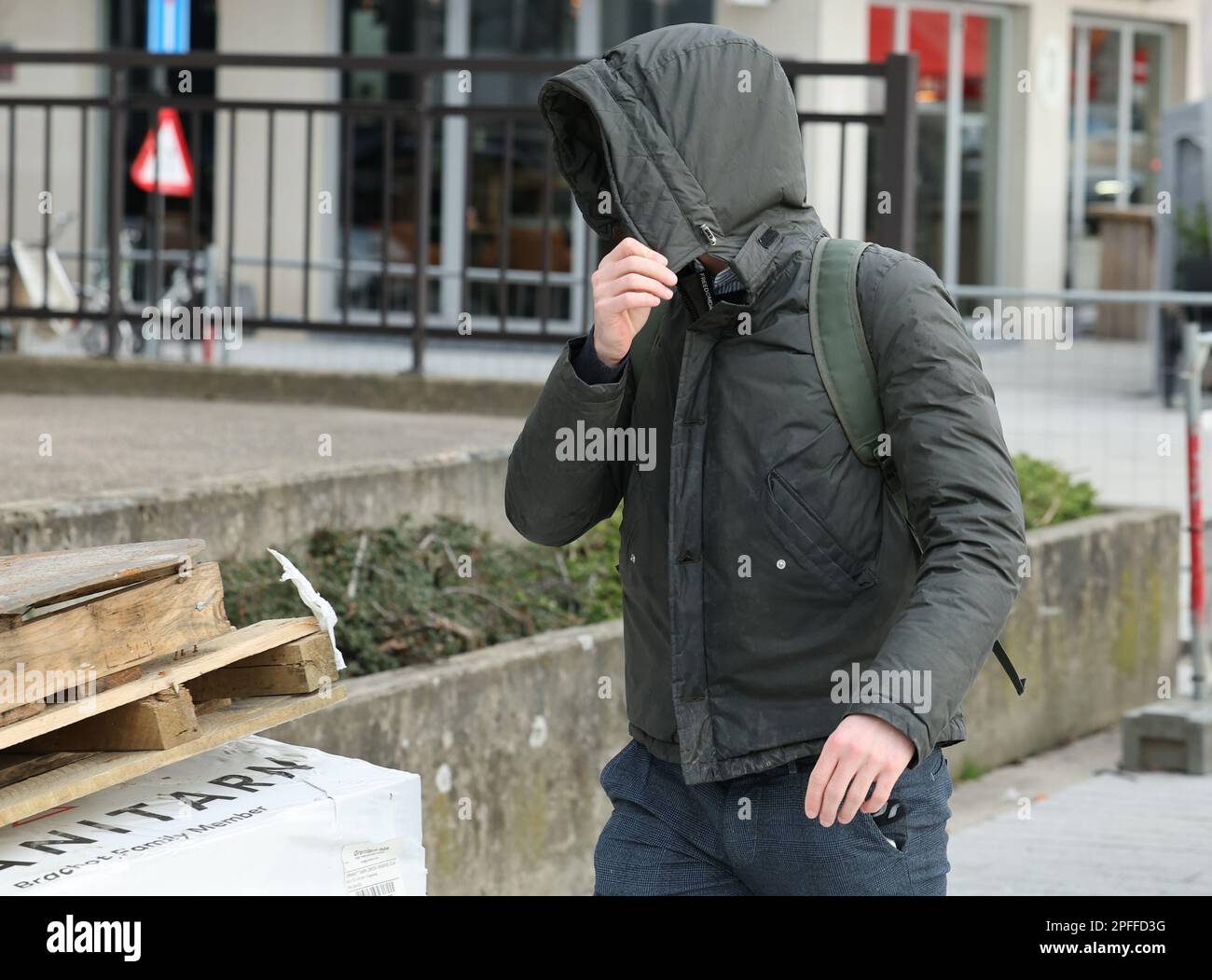 One of the accused arrives for a session of the case before the Antwerp