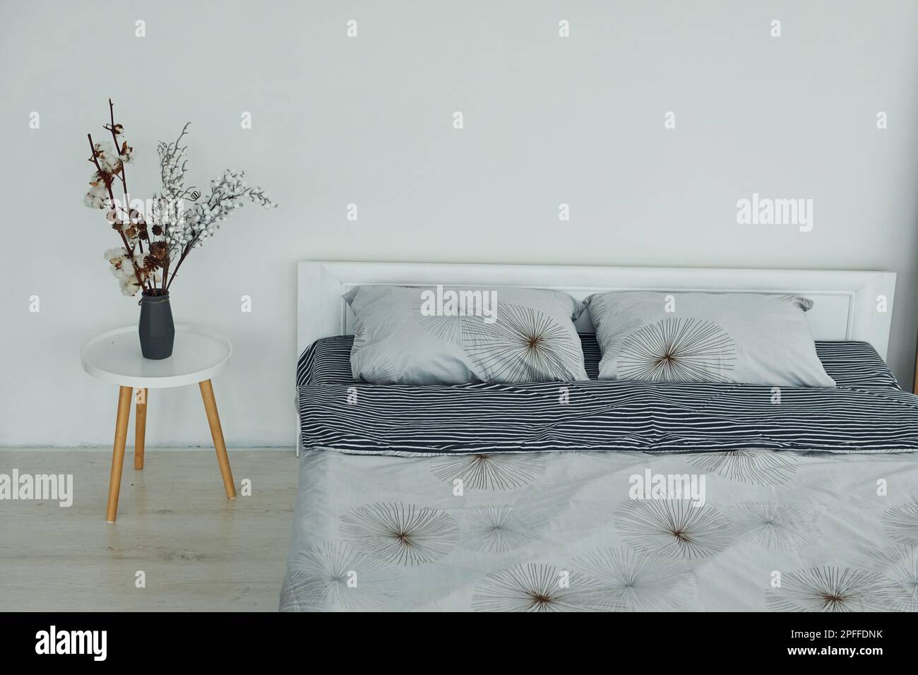 Grey bed. Interior and design of beautiful modern bedroom at daytime Stock Photo - Alamy