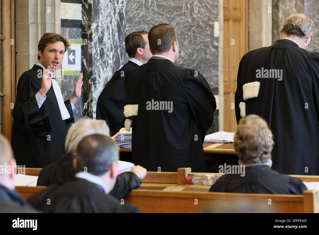 Lawyers pictured at the start of the trial against a gang accused of fixing tennis matches, before the correctional court, in Oudenaarde, Friday 17 March 2023. The gang made significant gambling profits from Belgium by fixing at least 375 tennis matches through an international network of 182 bribed professionals - 28 suspects, including seven Belgian tennis players, must answer in court for their involvement in mass match fixing in the professional circuit. The ringleader is the Armenian Grigor S., who directed an internationally branched network of accomplices, water carriers and, above all, Stock Photo
