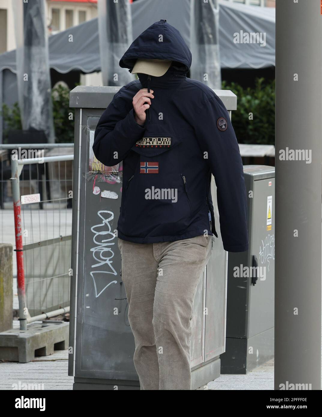 One of the accused arrives for a session of the case before the Antwerp