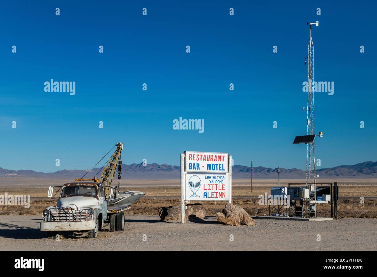 Old tow truck, Little A’Le’Inn motel sign, gamma radiation, survey meter tower, Extraterrestrial Hwy NV-375, in Rachel, Sand Spring Valley, Nevada USA Stock Photo