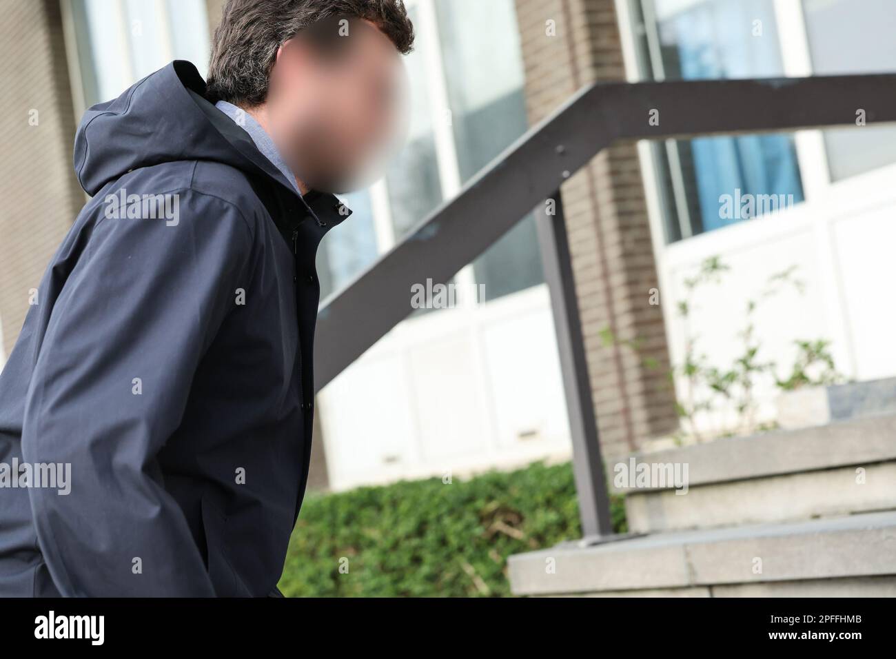 One of the accused arrives for a session of the case before the Antwerp