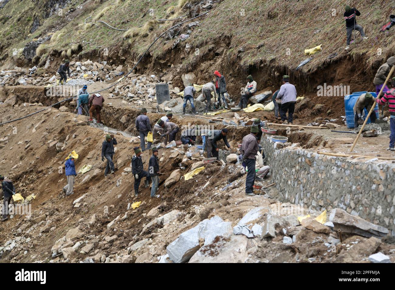 Rudarprayag, Uttarakhand, India, May 03 2014, Laborer rebuilding pathway damaged in Kedarnath disaster. Kedarnath was devastated on June 2013 due to l Stock Photo