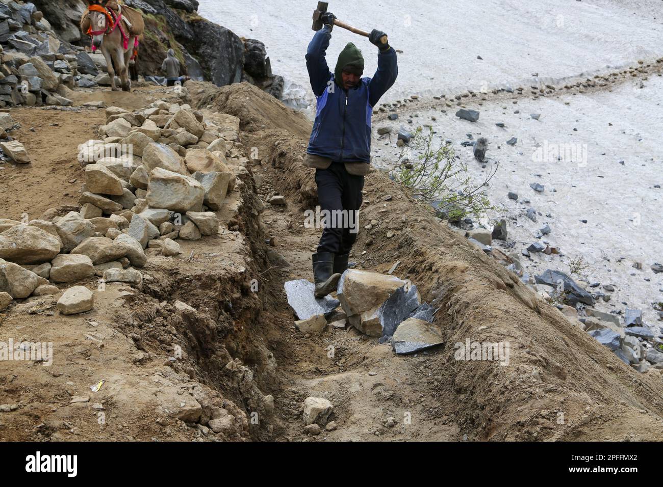 A labor working in Kedarnath reconstruction Project in India. Stock Photo