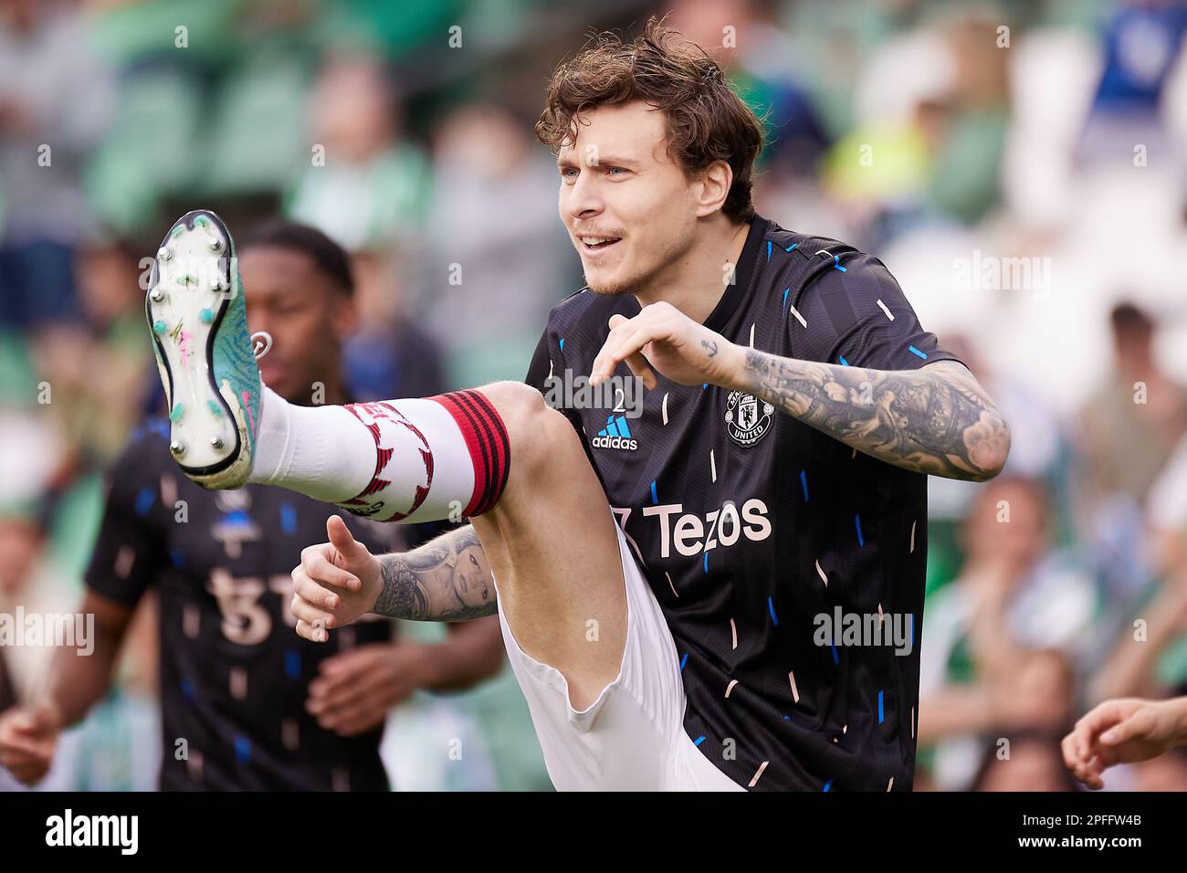 Seville, Spain. 16th Mar, 2023. Victor Lindelof of Manchester United is warming up before the UEFA Europa League match between Real Betis and Manchester United at Estadio Benito Villaarin in Seville. (Photo Credit: Gonzales Photo/Alamy Live News Stock Photo