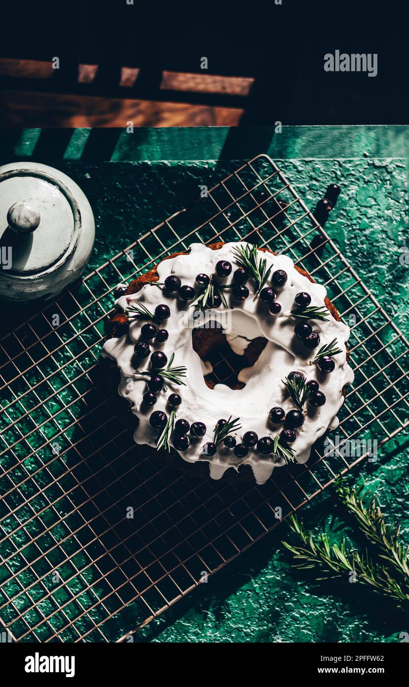 Berry pound cake on a green background. Stock Photo
