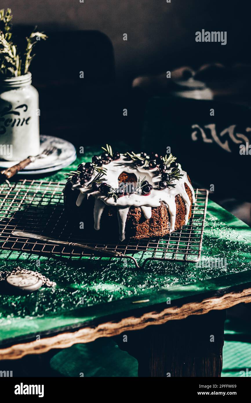 Berry pound cake on a green background. Stock Photo