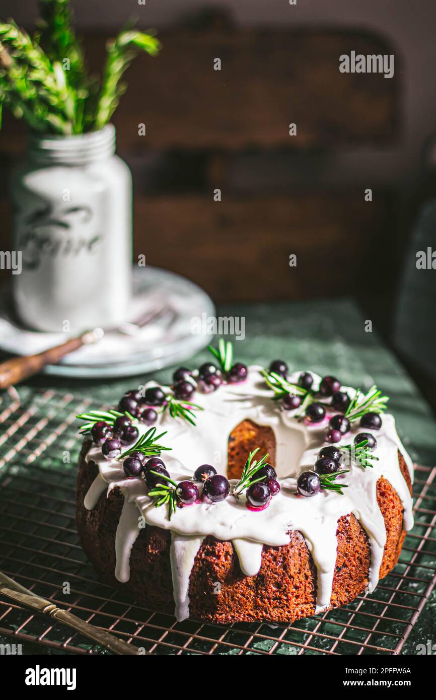 Berry pound cake on a green background. Stock Photo
