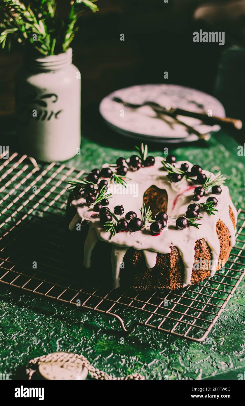 Berry pound cake on a green background. Stock Photo