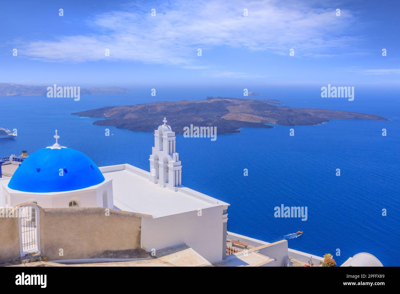 TheThree Bells of Fira, a Greek Catholic church in Santorini, member of the Cyclades group of islands in Greece. Stock Photo