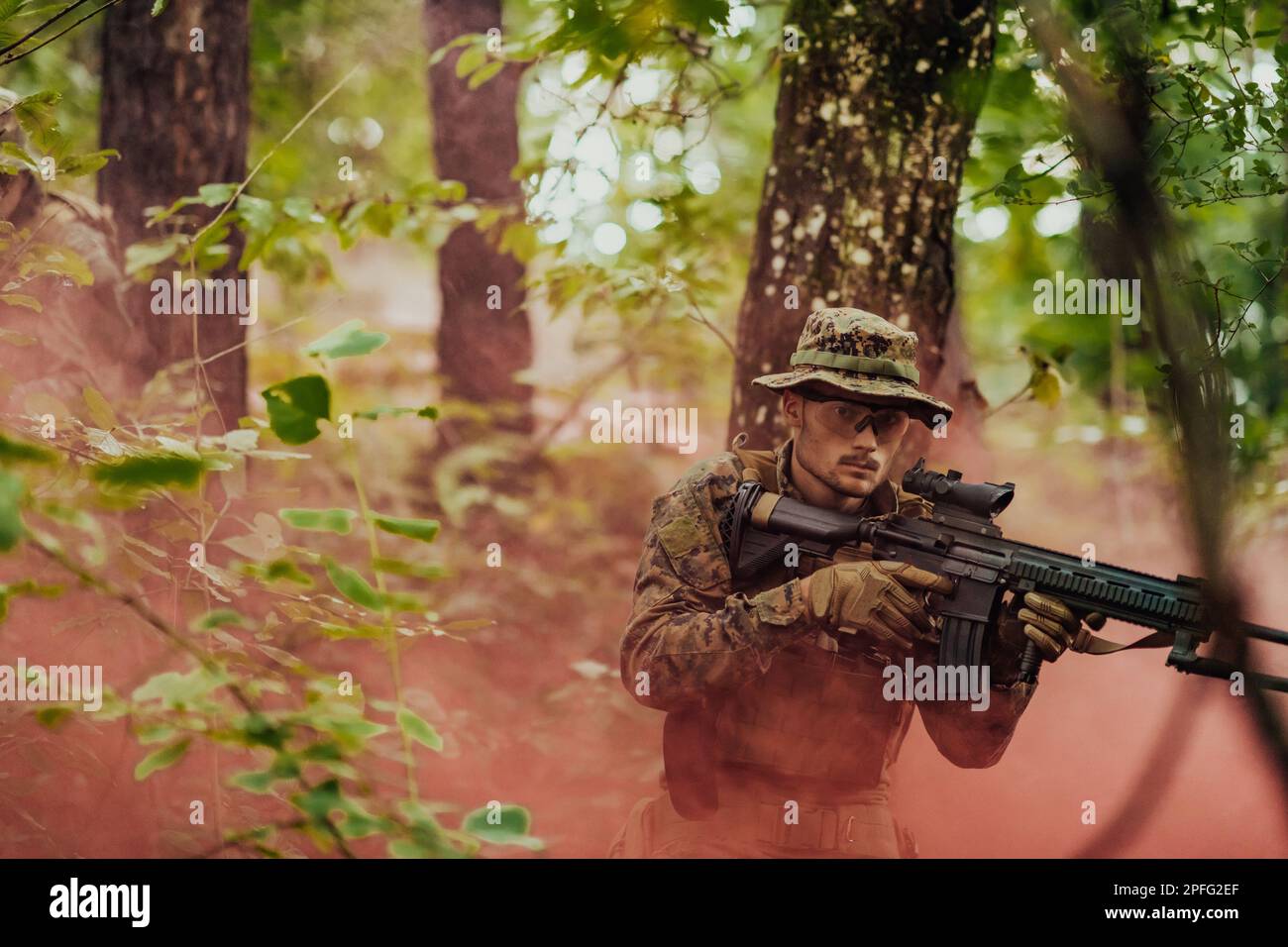 A modern warfare soldier on war duty in dense and dangerous forest ...