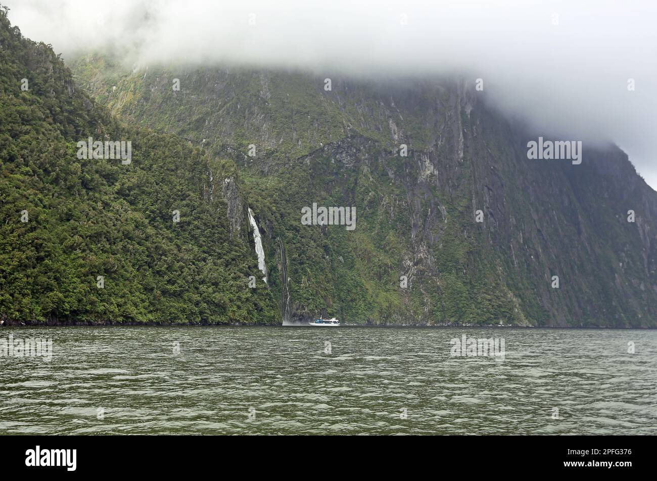 Stirling Falls and a ship - New Zealand Stock Photo