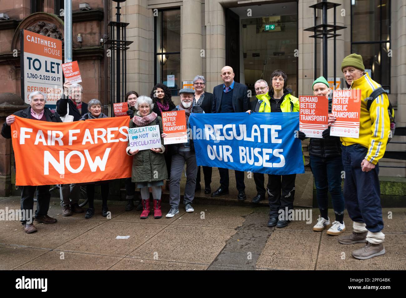 Glasgow, Scotland, UK - 17 March 2022: Get Glasgow Moving 'Fair Fares Now' Passenger Rally protesters meet councillors outside Strathclyde Partnership for Transport (SPT) offices. Glasgow fares are higher than many other cities and Get Glasgow Moving is calling for the SPT to seize the new powers in the Transport Act 2019 to regulate the private bus companies, cap fares and deliver a fully-integrated public transport system across Glasgow. Pictured: protestors alongside Councillors Alan Moir (Scottish Labour and Vice chair of SPT), Maureen Devlin (Scottish Labour), Roza Salih (SNP)  Michael M Stock Photo