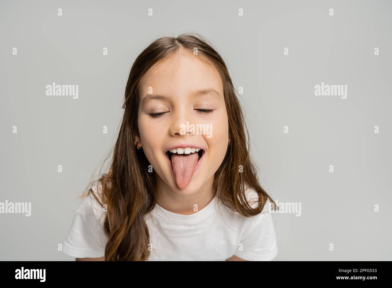 Preteen faces tongue 