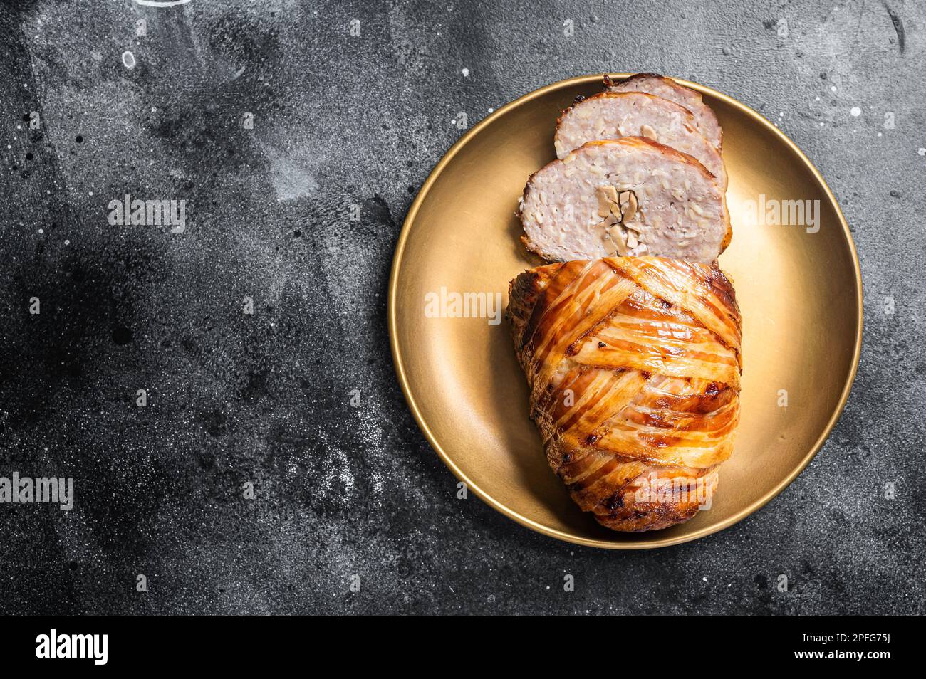Roasted bacon wrapped meatloaf, sliced mince meat loaf. Black