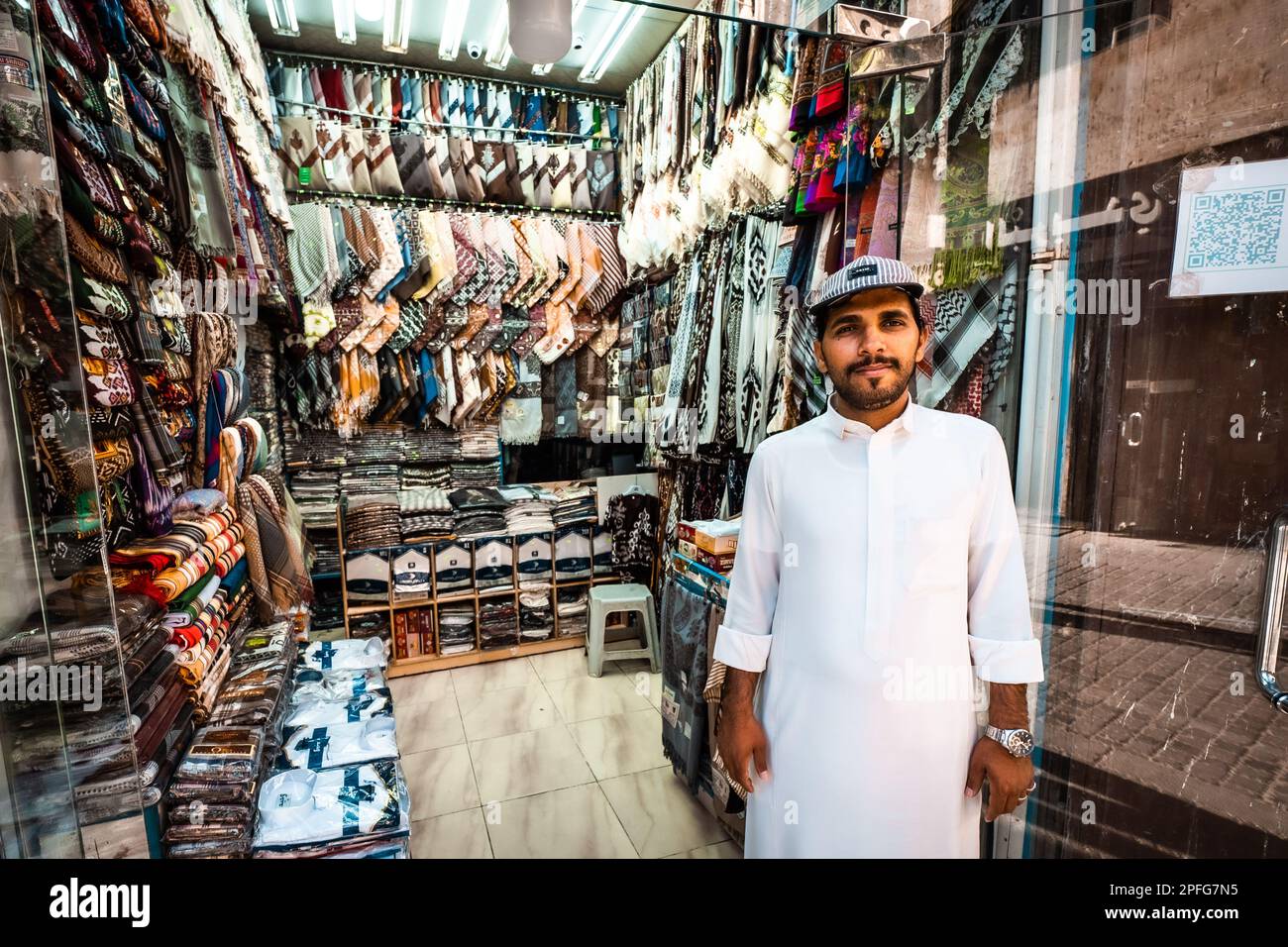 Portrait of proud textiles salesman in his shop at Souk Baab Makkah (Bab Makkah) street at the historic district Al-Balad in Jeddah, KSA, Saudi Arabia Stock Photo