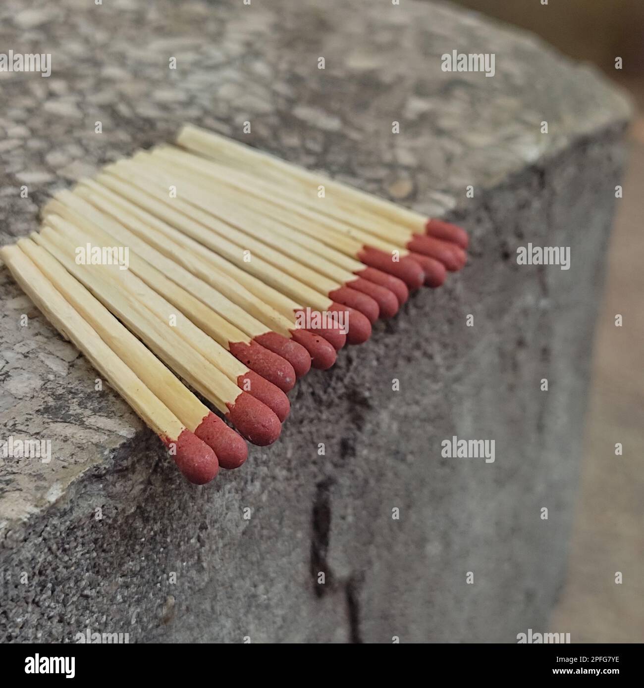 Close up of open single cardboard match box on granite stone background