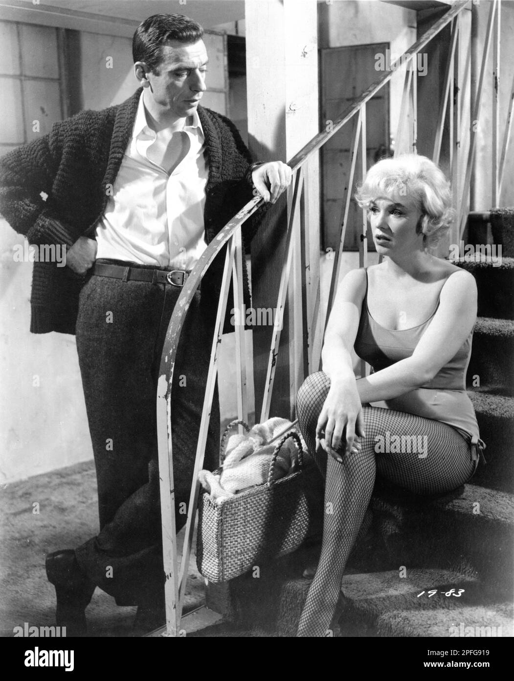 YVES MONTAND and MARILYN MONROE in LET'S MAKE LOVE 1960 director GEORGE CUKOR writer Norman Krasna costume design Dorothy Jeakins Jerry Wald Productions / Twentieth Century Fox Stock Photo
