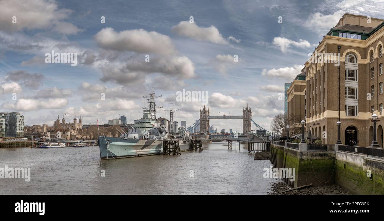 HMS Belfast moored on the River Thames alongside The Queens Walk in the Pool of London, Southwark. HMS Belfast is a Town-Class light cruiser that was Stock Photo