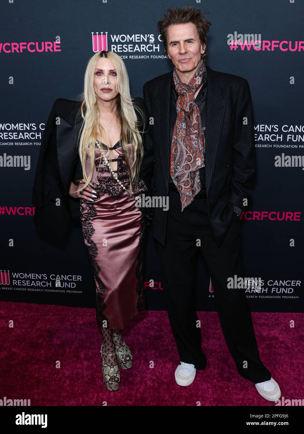 BEVERLY HILLS, LOS ANGELES, CALIFORNIA, USA - MARCH 16: Gela Nash-Taylor and husband/British musician John Taylor of English rock band Duran Duran arrive at The Women's Cancer Research Fund's An Unforgettable Evening Benefit Gala 2023 held at the Beverly Wilshire, A Four Seasons Hotel on March 16, 2023 in Beverly Hills, Los Angeles, California, United States. (Photo by Xavier Collin/Image Press Agency) Stock Photo