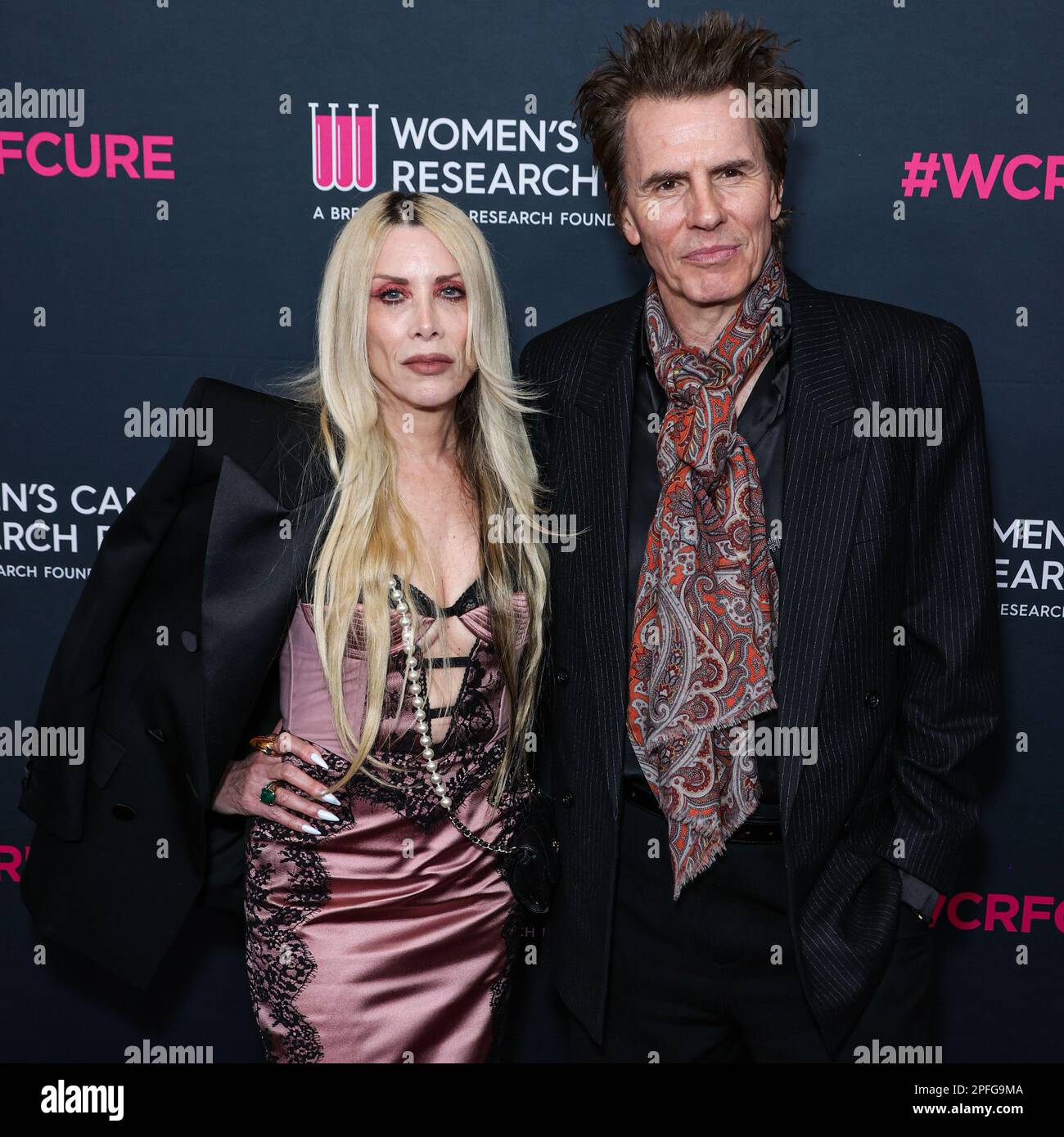 BEVERLY HILLS, LOS ANGELES, CALIFORNIA, USA - MARCH 16: Gela Nash-Taylor and husband/British musician John Taylor of English rock band Duran Duran arrive at The Women's Cancer Research Fund's An Unforgettable Evening Benefit Gala 2023 held at the Beverly Wilshire, A Four Seasons Hotel on March 16, 2023 in Beverly Hills, Los Angeles, California, United States. (Photo by Xavier Collin/Image Press Agency) Stock Photo