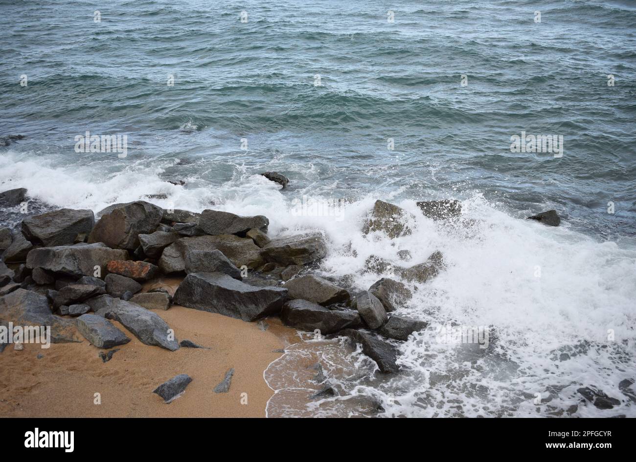 A beautiful view of sea waves crashing with rocks on the shore Stock ...