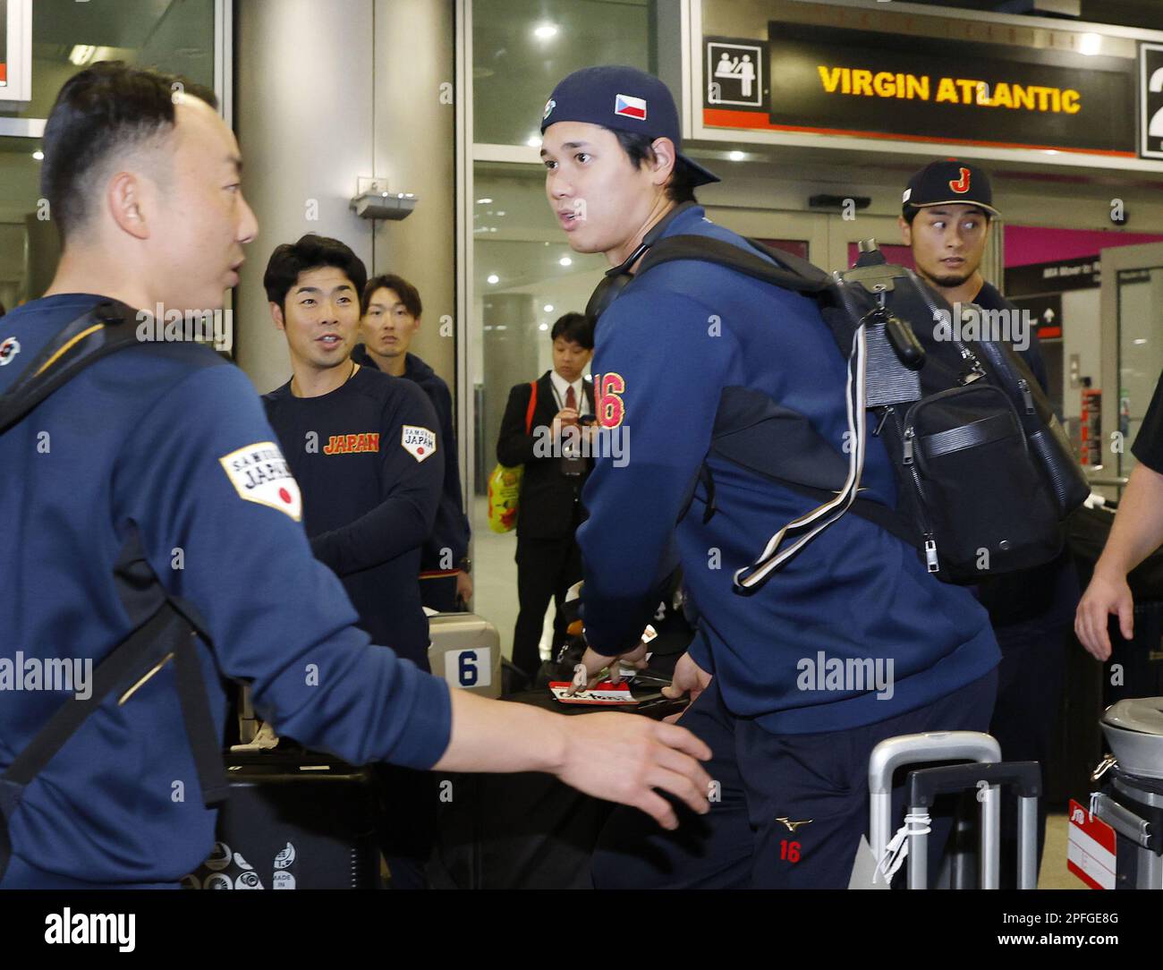 Shohei Ohtani of Japan's World Baseball Classic team is soaked in a  champagne shower celebration in Miami, Florida, on March 22, 2023, after  the team claimed the WBC championship. (Kyodo)==Kyodo Photo via