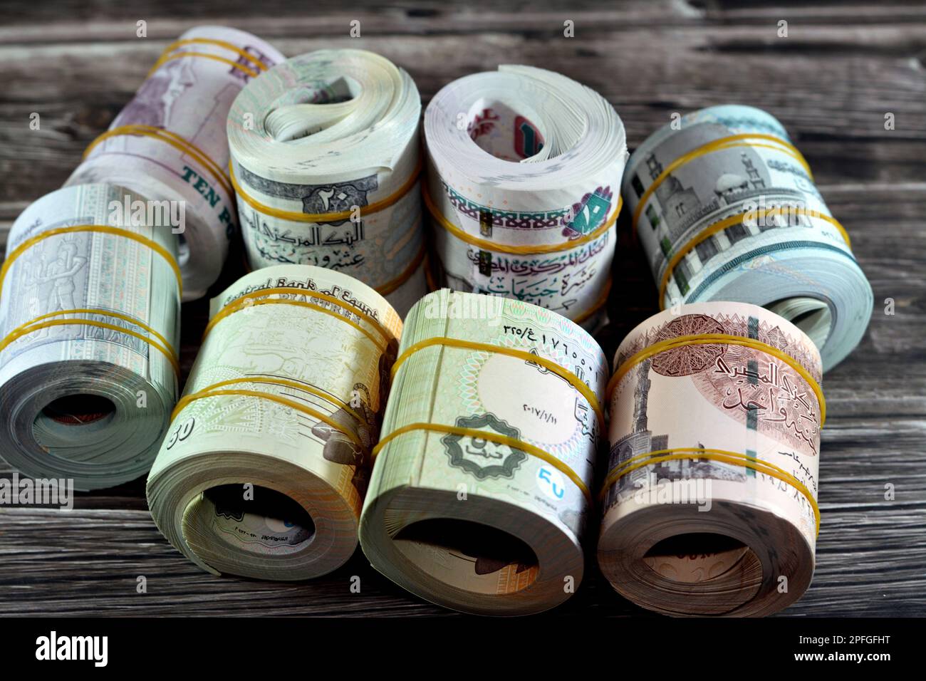 Background of bundles and rolls of Egyptian money currency cash