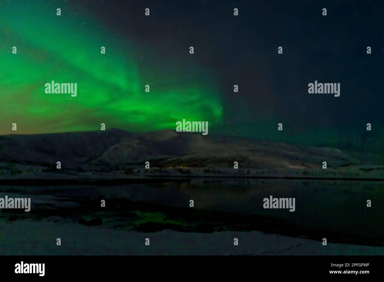 aurora borealis northern lights in a mşsty weather in tromso, norway Stock Photo