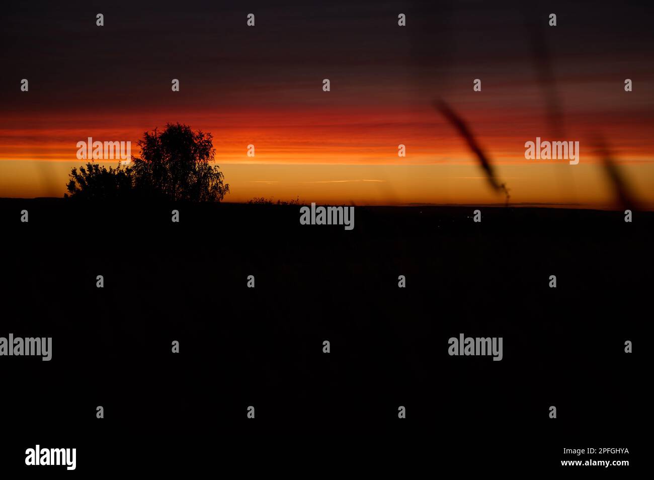 Red contrasting clouds after sunset Stock Photo