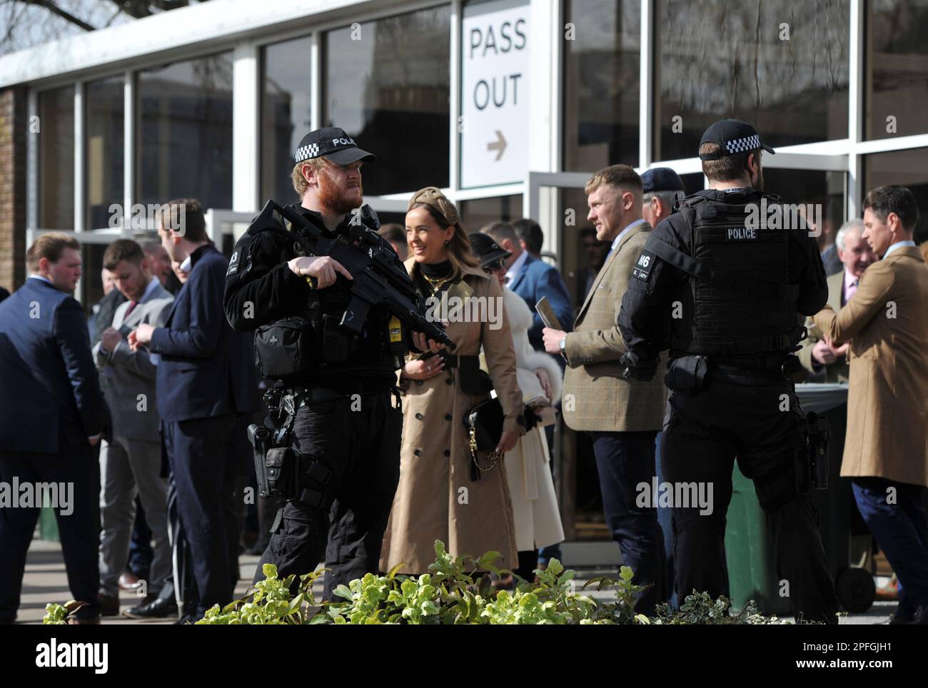 Armed police at the gate as crowds enter Cheltenham Racecourse   Horse racing at Cheltenham Racecourse on Day 4 the final day of the Cheltenham Festiv Stock Photo
