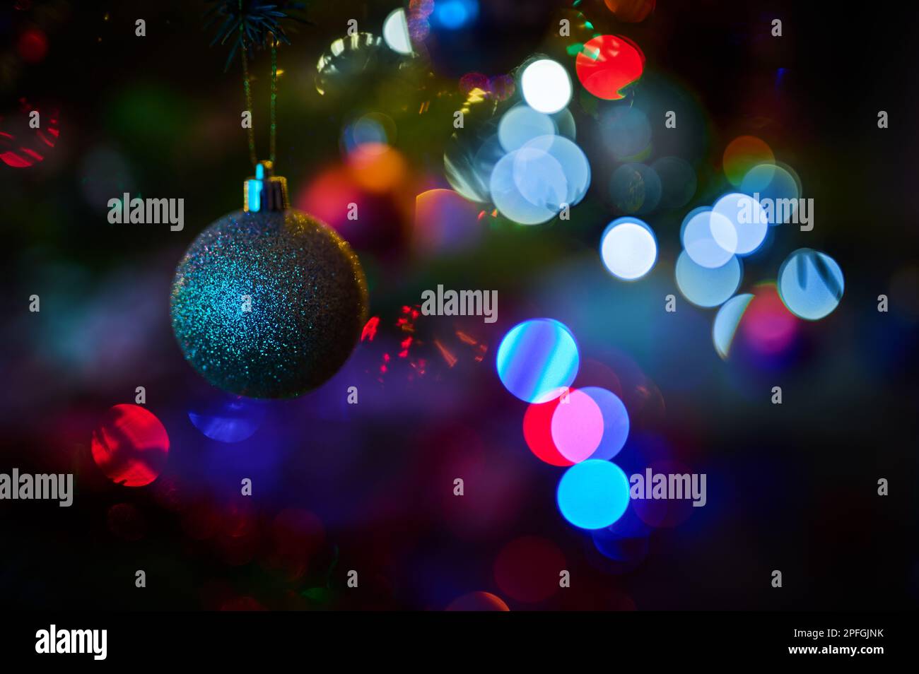 Christmas balls and other christmas decorations on the holiday tree ...